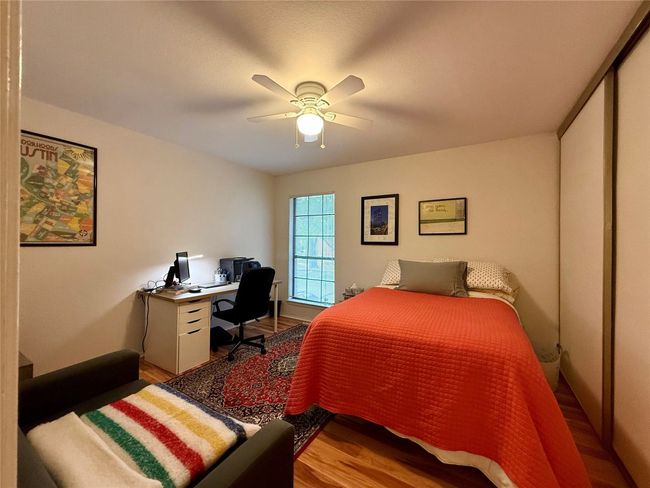 Bedroom featuring a ceiling fan and wood finished floors | Image 13