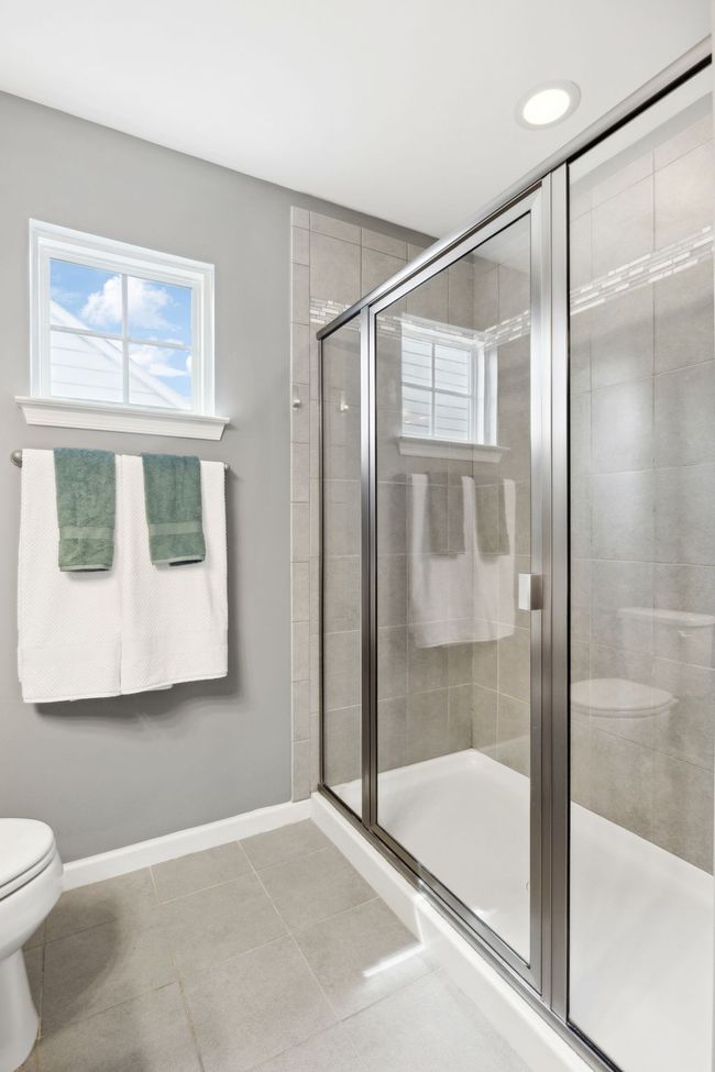 Take your time in the luxurious shower as you watch the clouds float by from the elevated window | Image 23
