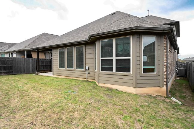 Back of property with a lawn and a fenced backyard | Image 8