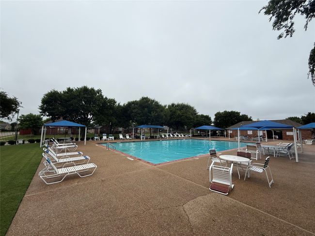 Community pool featuring a gazebo and a patio area | Image 33