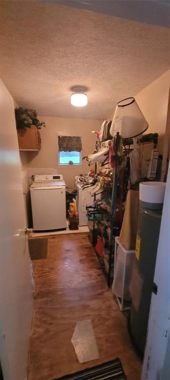 Laundry room and plenty of storage. | Image 14