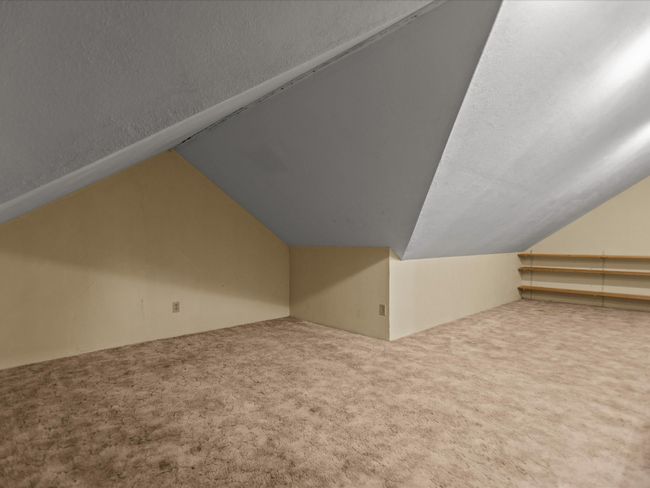 Bonus room featuring carpet flooring and lofted ceiling | Image 35