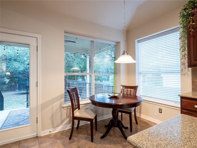 Tiled dining space in the kitchen featuring plenty of natural light | Image 11