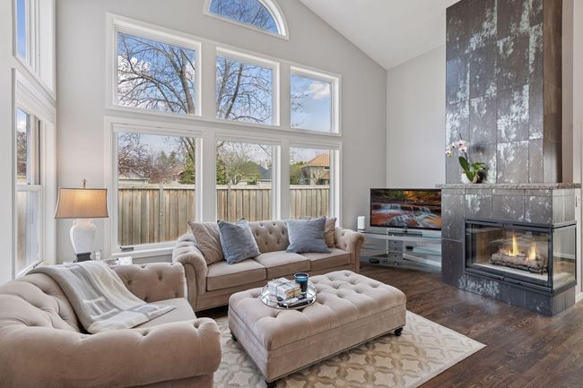 Dramatic fireplace facade adds a sleek design element to this space | Image 6