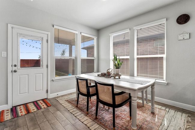 Dining area featuring wood finished floors | Image 7