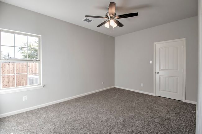 Empty room featuring a ceiling fan and carpet | Image 14