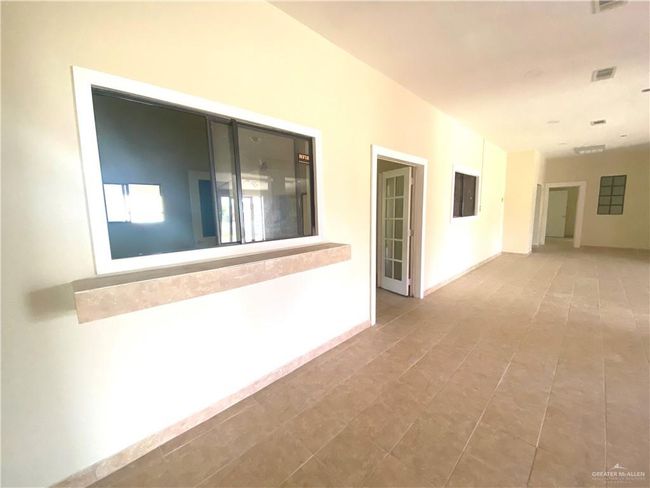 Corridor with tile flooring | Image 9