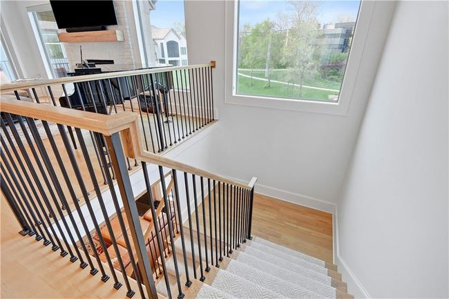 Stairway featuring baseboards and wood finished floors | Image 39