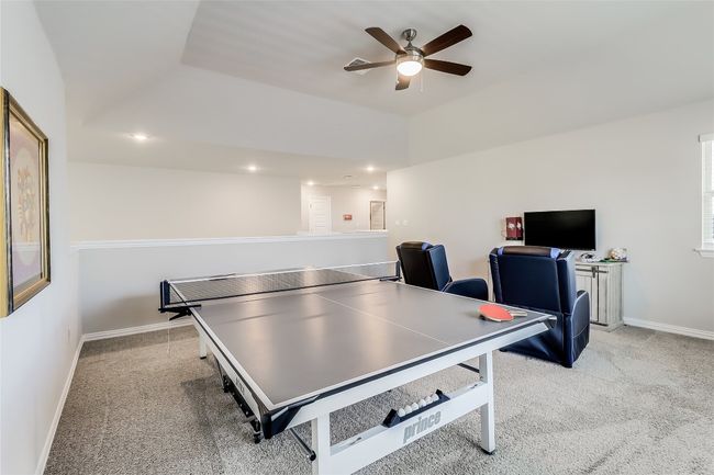 Rec room featuring a ceiling fan, carpet, baseboards, and recessed lighting | Image 31