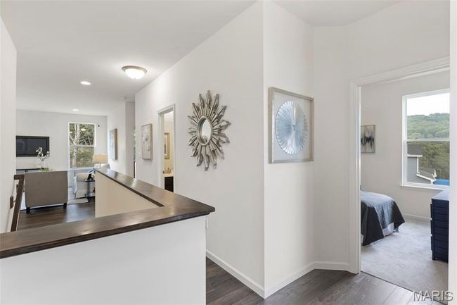 Hall featuring dark wood-style floors, baseboards, and recessed lighting | Image 6
