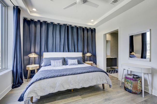 Bedroom featuring wood finished floors, recessed lighting, ensuite bath, and ceiling fan | Image 15