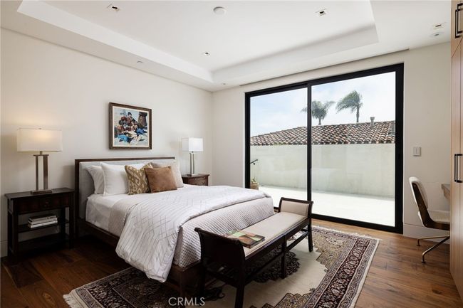 Side secondary bedroom features ensuite bathroom and direct access to the side patio through your private sliding doors. | Image 19