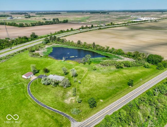aerial view of property and surrounding area featuring a large body of water | Image 9