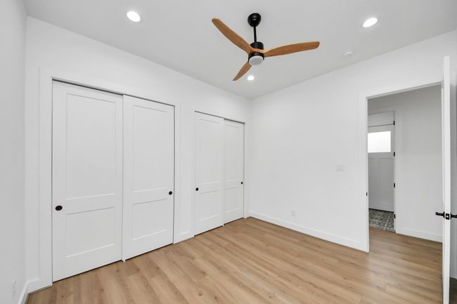 Secondary bedroom features awindow, ceiling fan, and recessed lighting. | Image 22
