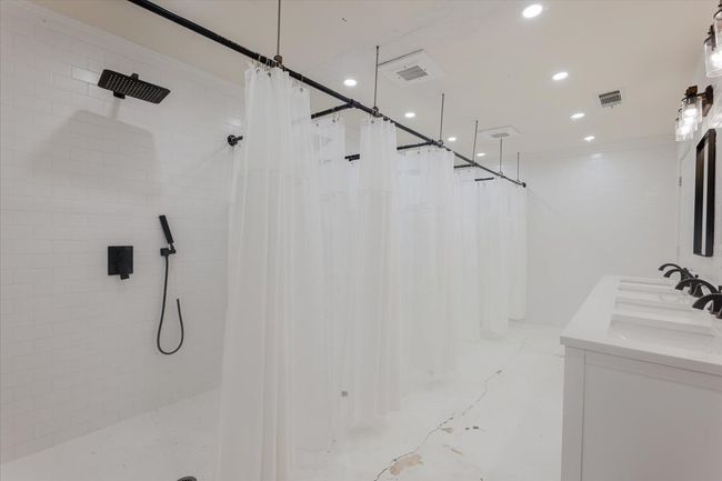 Building 3 - The shower room is complete with beautiful tile surround and top notch fixtures. | Image 20