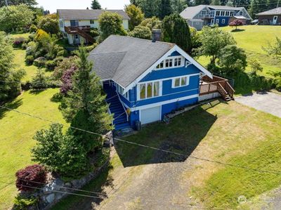 House with location of garage door | Image 3