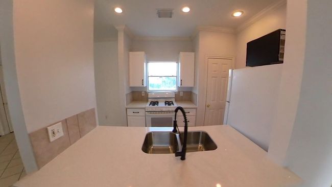 another view of the kitchen in the 5508 Texas upstairs unit. | Image 7