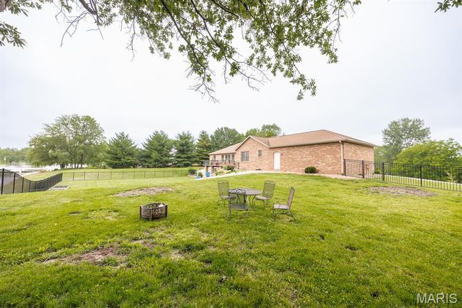 View of yard with a fire pit | Image 48