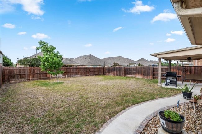 Back sidewalk across the yard is brick lined & leads to patio. | Image 34
