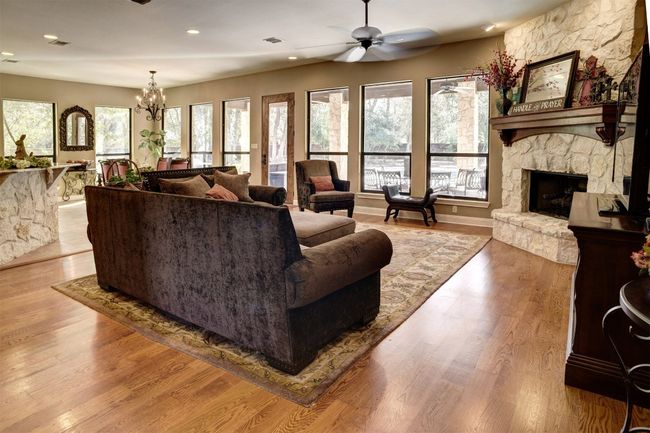 Downstairs living area with views of pool and back yard. | Image 11