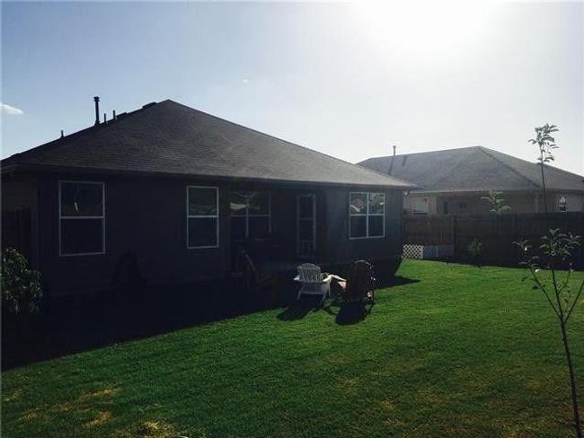 Rear view of property featuring a shingled roof | Image 12