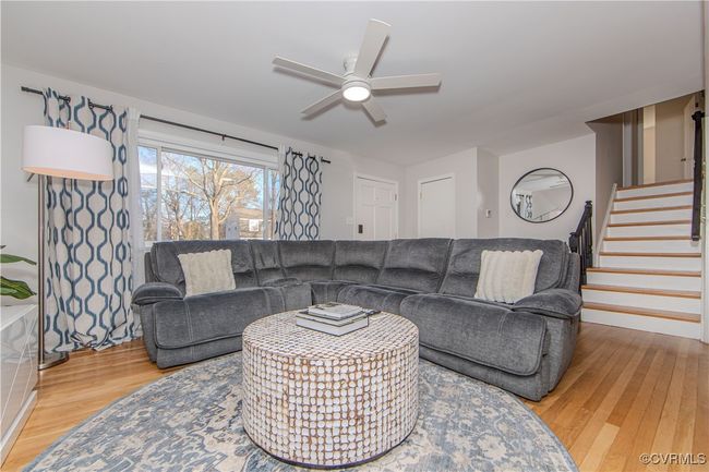 Living room with hardwood / wood-style flooring and ceiling fan | Image 17