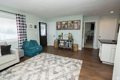 Living room featuring dark wood-type flooring | Image 3