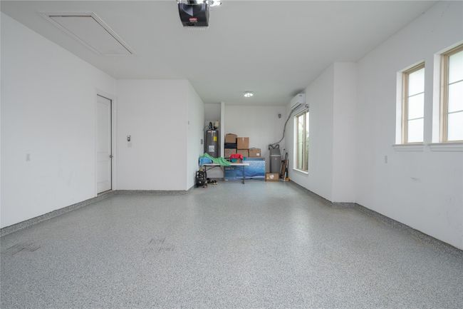 Large climate controlled garage with premium floor | Image 31