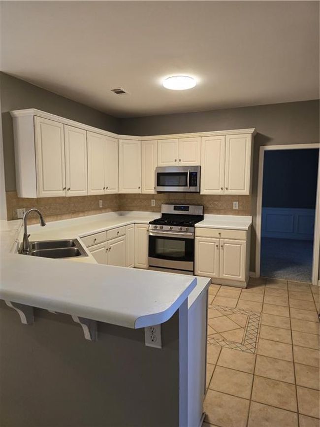 1434 Oglethorpe Dr, House other with 4 bedrooms, 3 bathrooms and null parking in Suwanee GA | Image 13