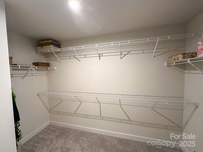 Primary bedroom walk-in closet | Image 15