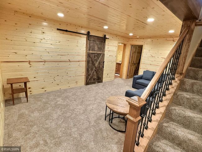 Recently finished, the lower level is comfortable and perfect for gathering and entertaining friends and family. | Image 24