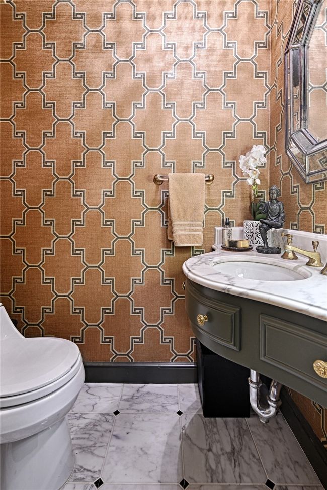 Powder room for guests featuring wallpapered walls, marble tile flooring, and vanity | Image 19