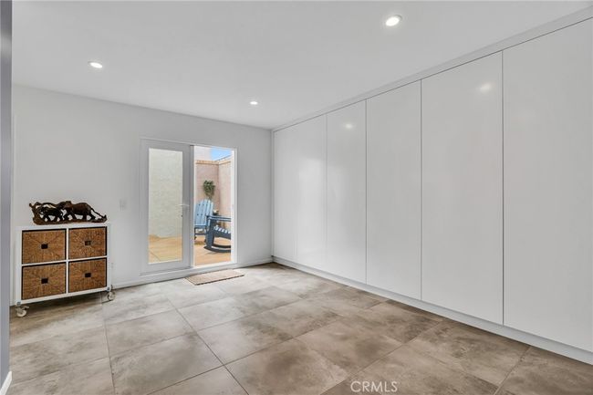 Nice large playspace or crafting area off the primary and second bedroom with lots of wall storage | Image 30