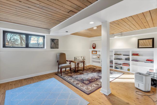 Sitting room featuring wood ceiling, track lighting, and hardwood / wood-style flooring | Image 23