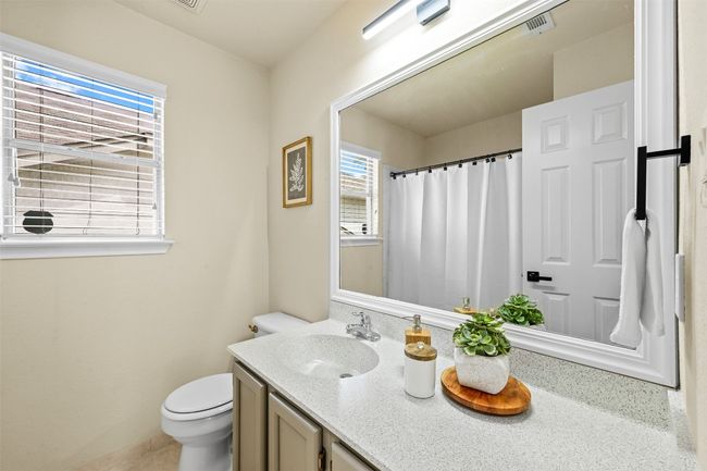 Bathroom with vanity and a shower with curtain | Image 27