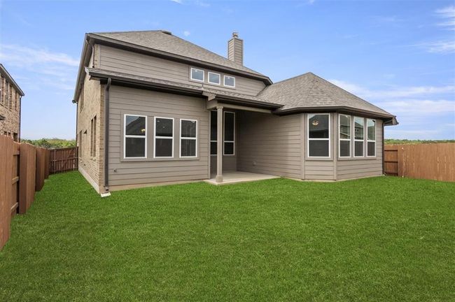 Back of house featuring a chimney and a patio | Image 26