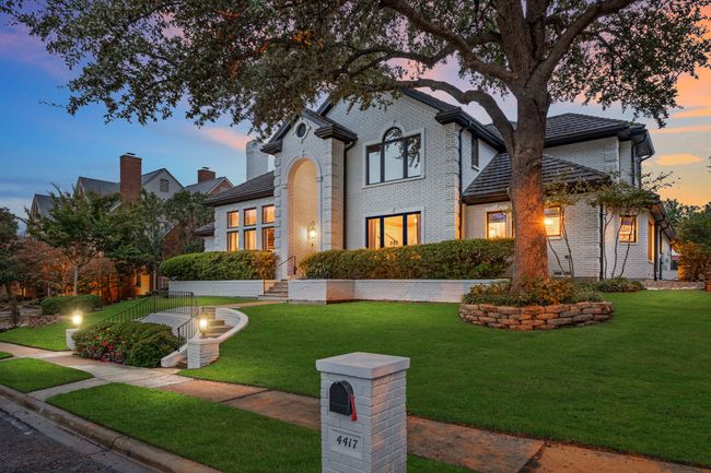View from front showing mature landscaping and trees | Image 38