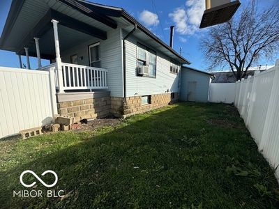 small side yard that leads to utility room | Image 2