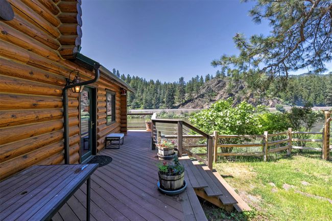 Wooden deck with a wooded view | Image 50