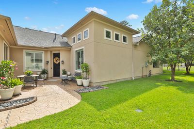 Front door is located on the right side of the house. Lovely courtyard entry | Image 3