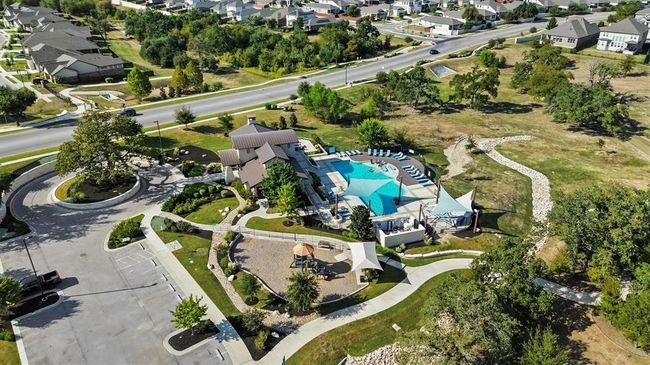 Aerial view of property and surrounding area with a pool and nearby suburban area | Image 35