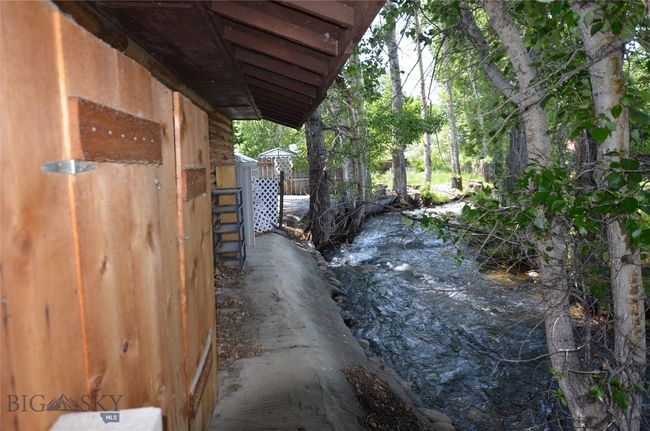 Side of house with Mill Creek | Image 5