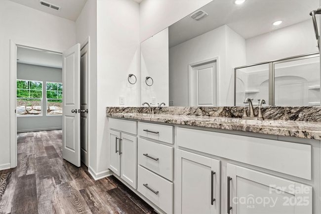 Primary bath with dual vanities | Image 15