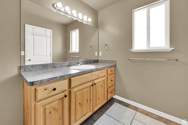 Bathroom with vanity and tile patterned floors | Image 16