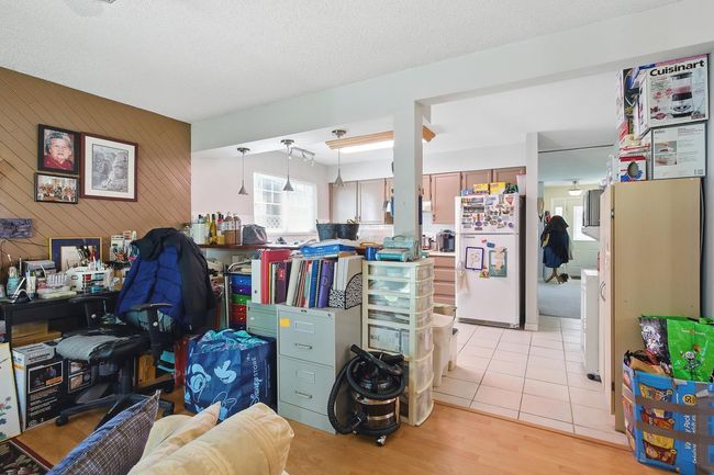 Misc room with light wood finished floors and wooden walls | Image 9