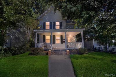 View of front of home with a front yard and covered porch | Image 2