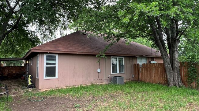 Rear view of property with roof with shingles and central AC | Image 19