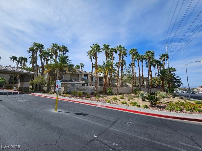 View of street with sidewalks, curbs, and street lights | Image 35