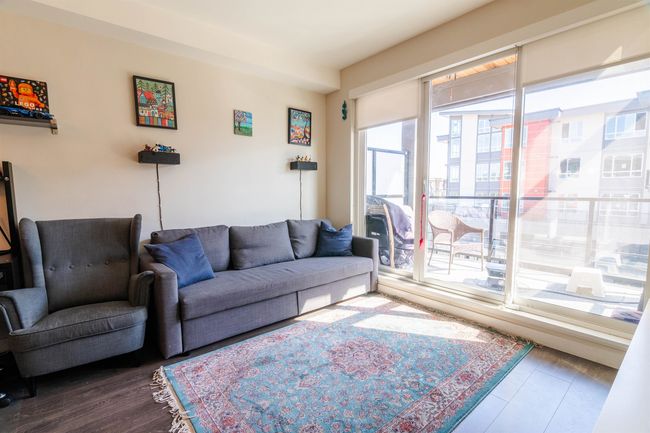 Living room with wood finished floors | Image 7
