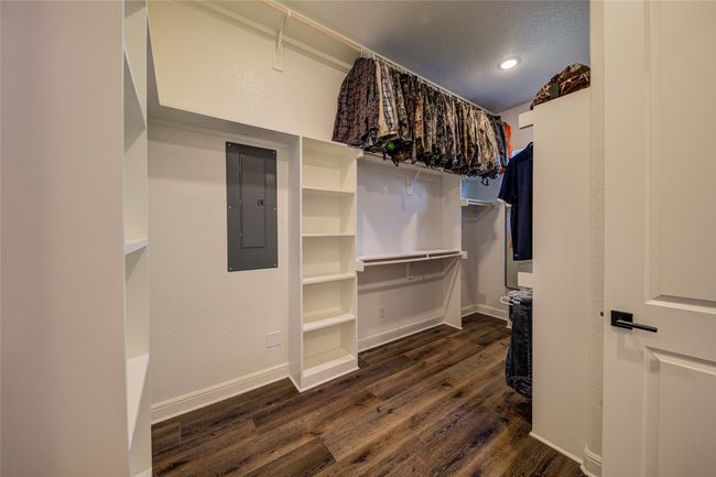 Spacious closet with dark hardwood / wood-style flooring | Image 18